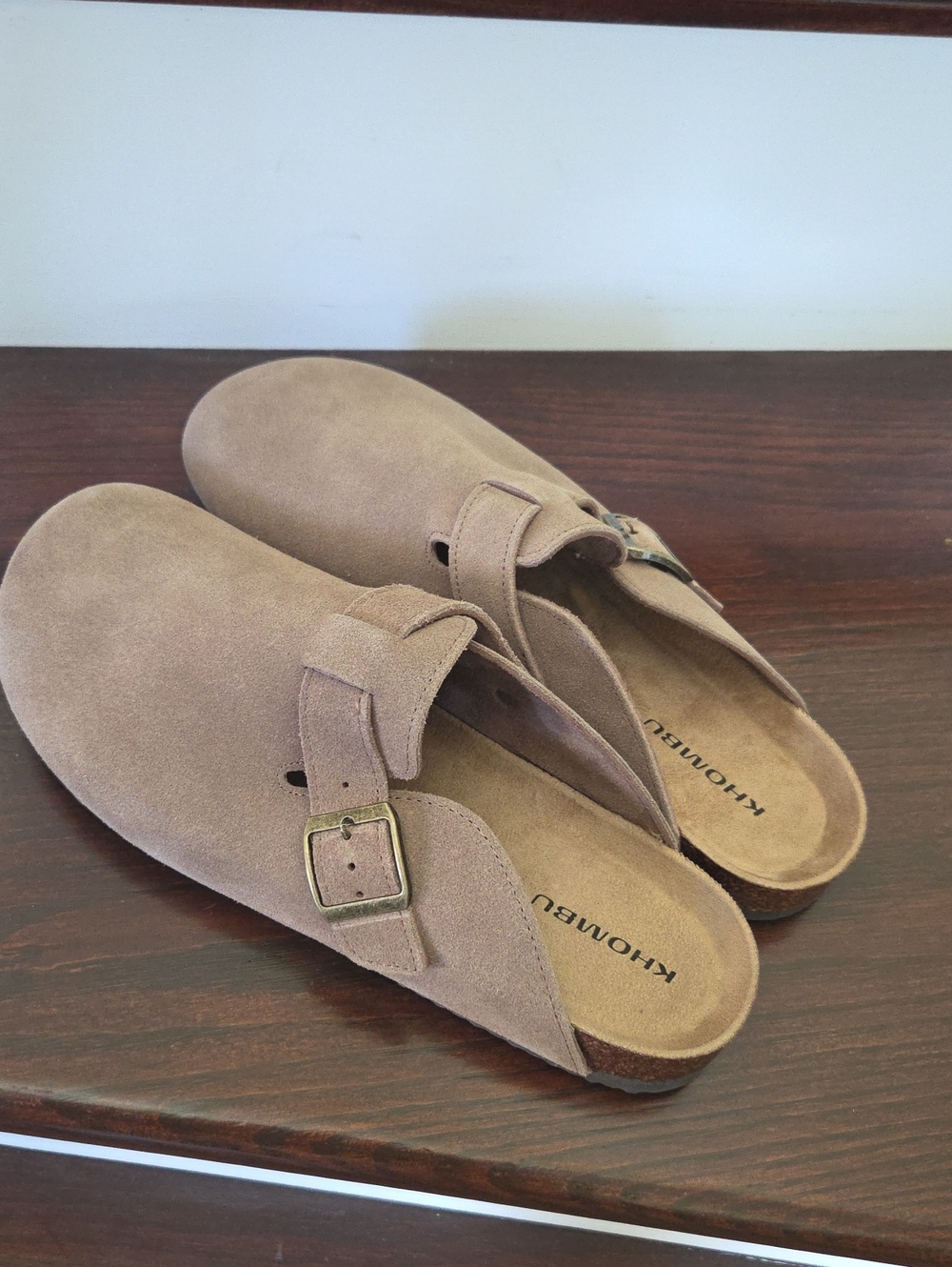 Khombu Taupe Suede Slip-On Clogs with Buckle Accent
